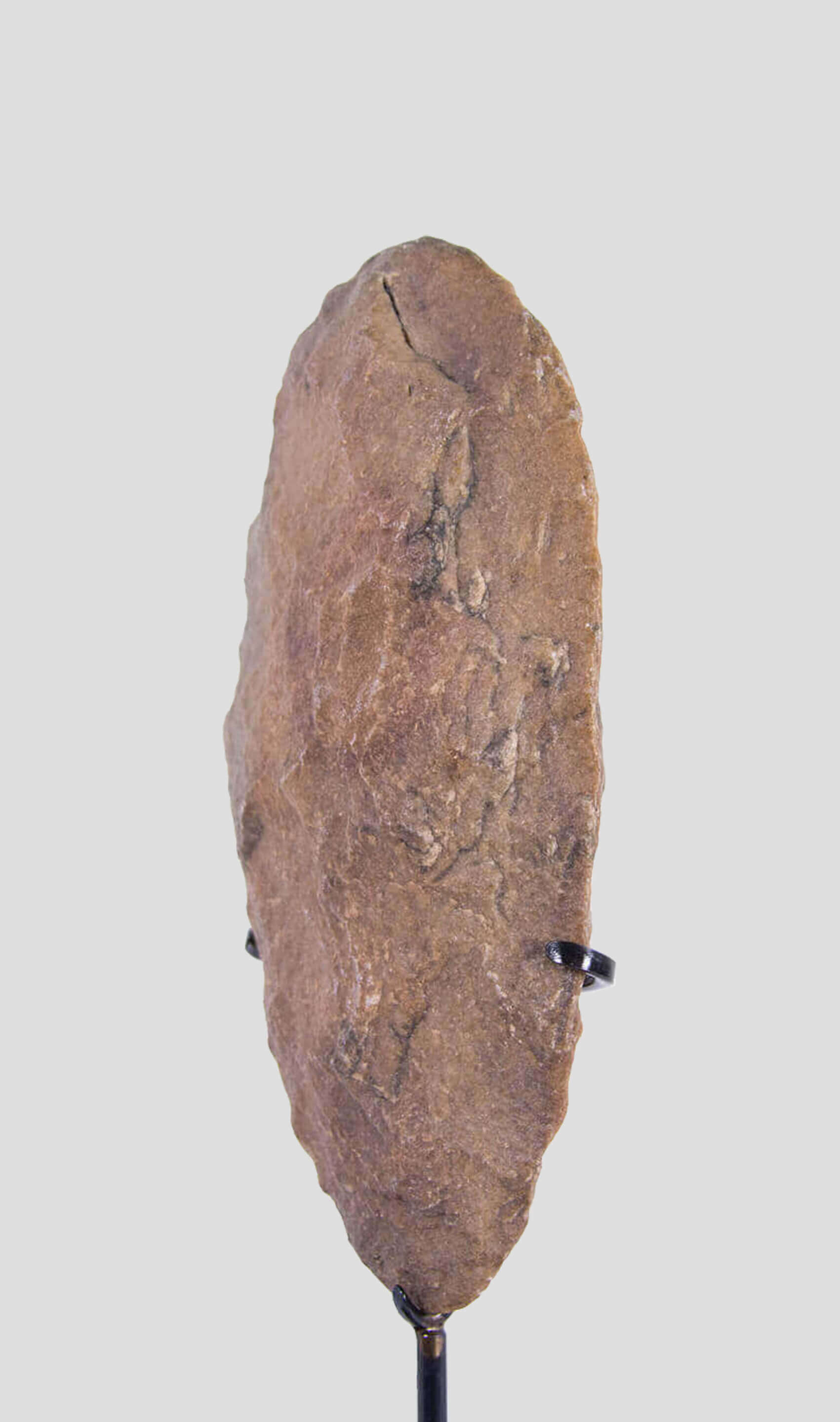 A stunning hand axe artefact for sale in a peach tone colour