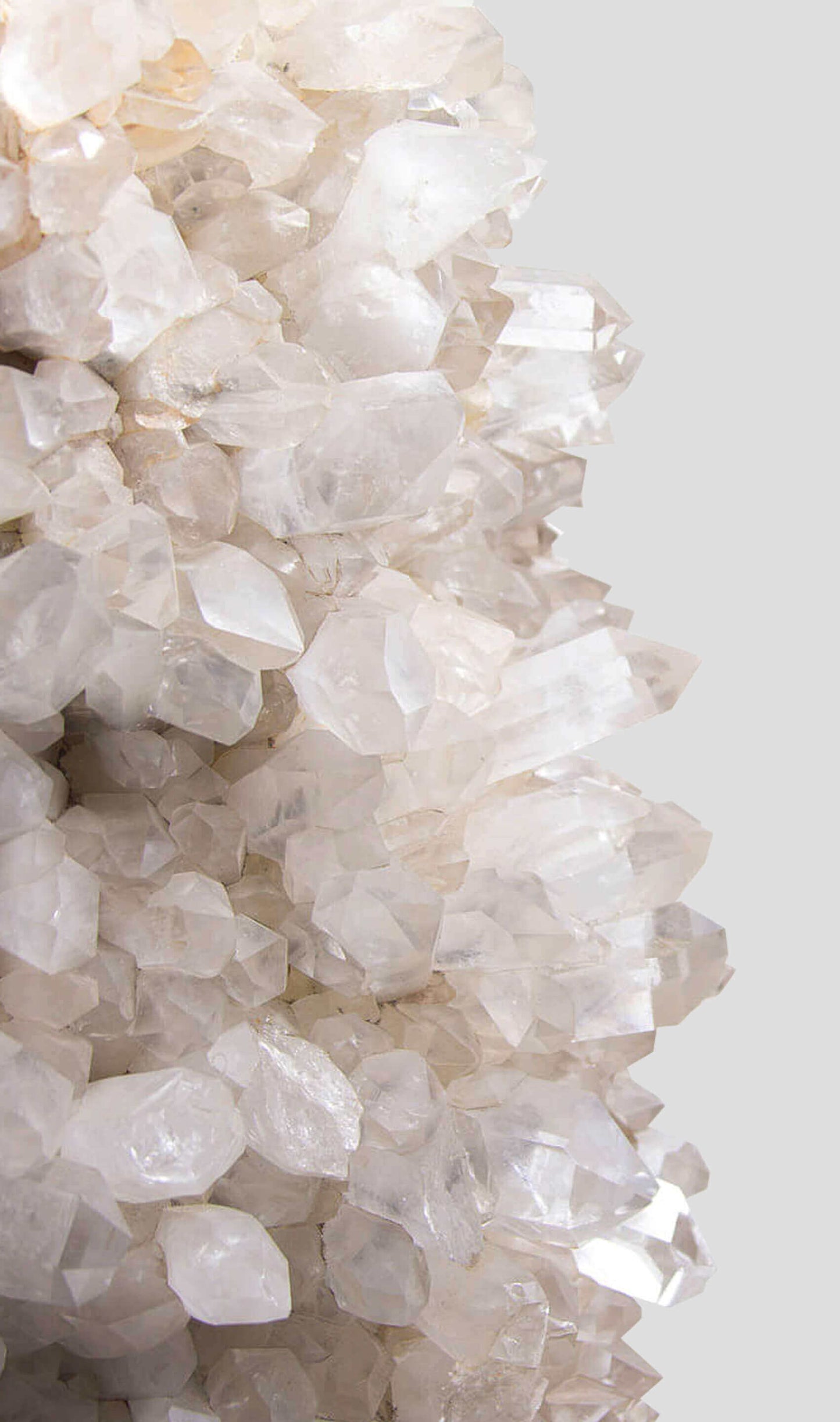 large quartz bed stylised for the modern interiors set in a luxurious brass table frame with glass top