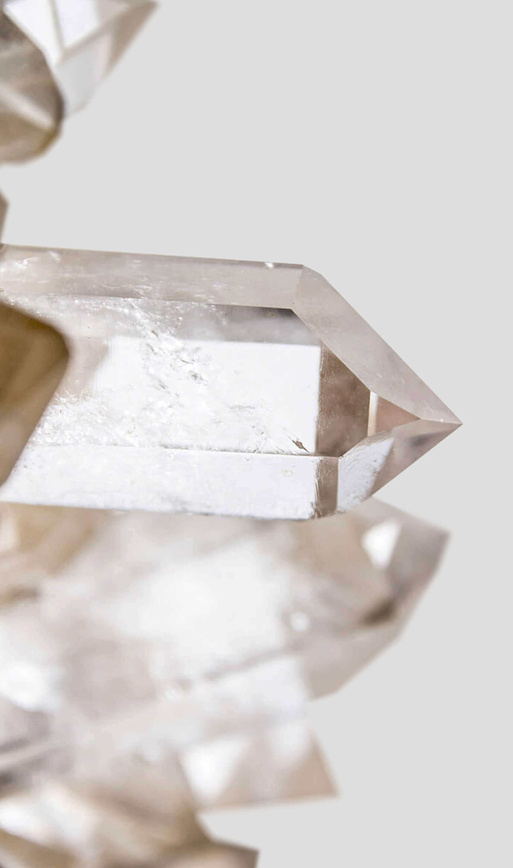 large quartz bed table stylised for the modern interior set in a luxurious brass table frame with glass top
