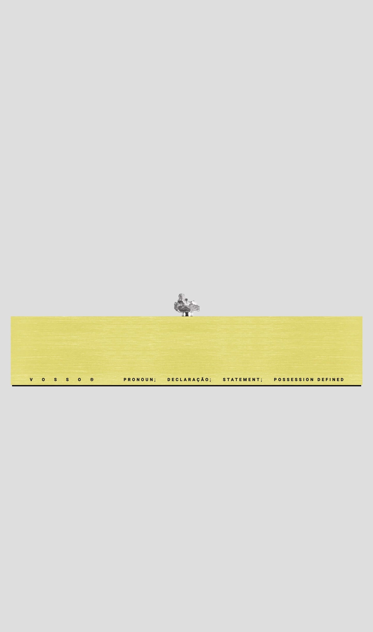 VRAI gift card display with yellow background and minimalist text design, showcasing elegance and modern aesthetics.
