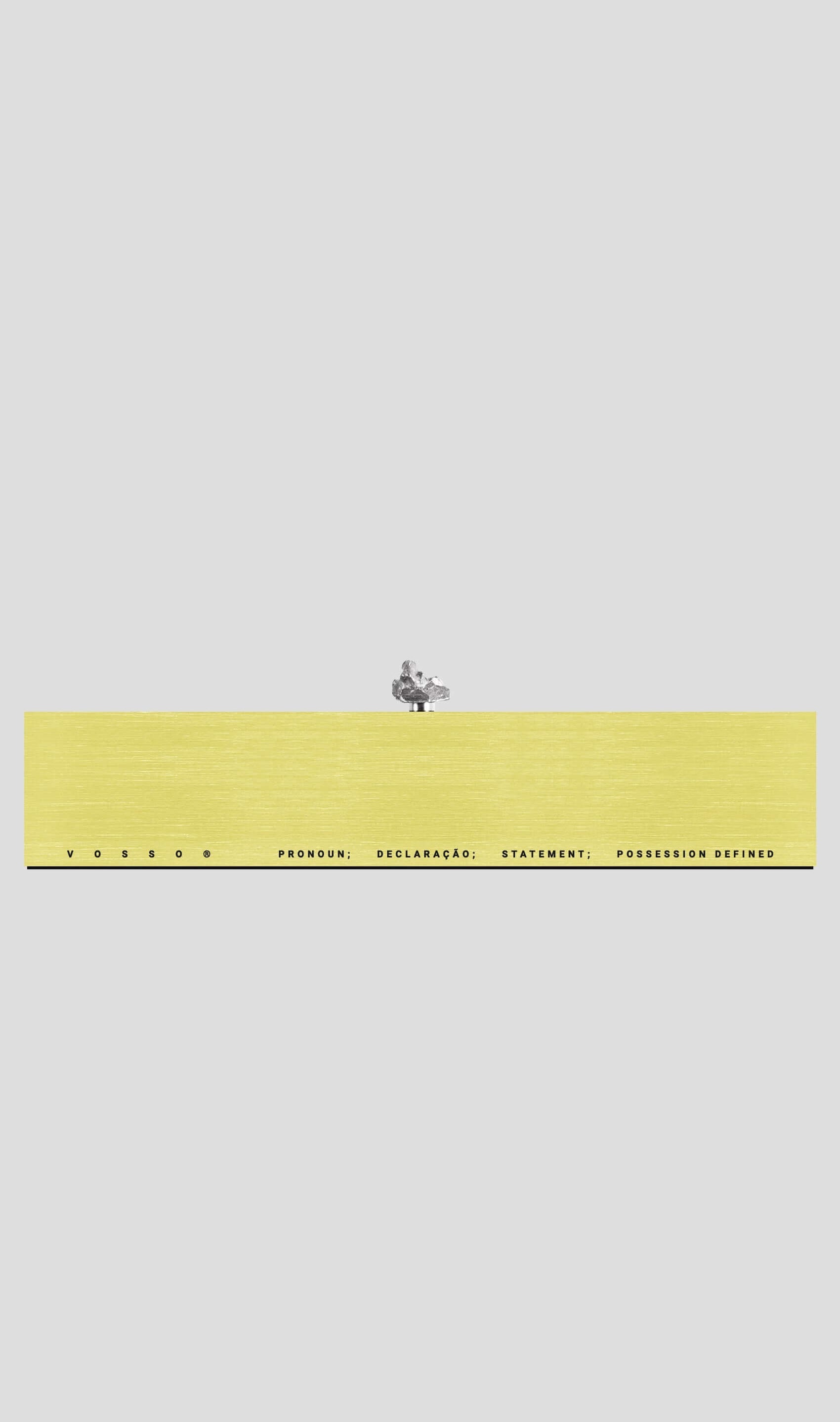 VRAI gift card display with yellow background and minimalist text design, showcasing elegance and modern aesthetics.