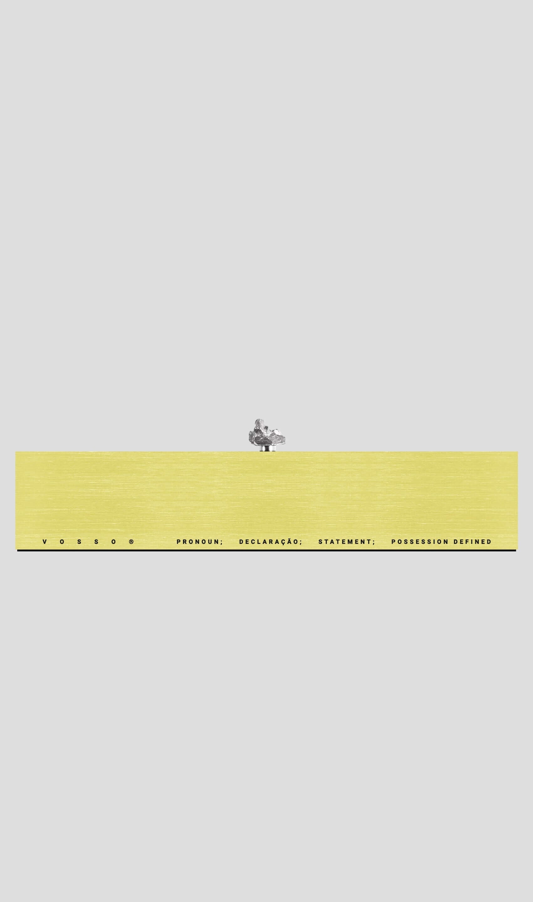 VRAI gift card display with yellow background and minimalist text design, showcasing elegance and modern aesthetics.