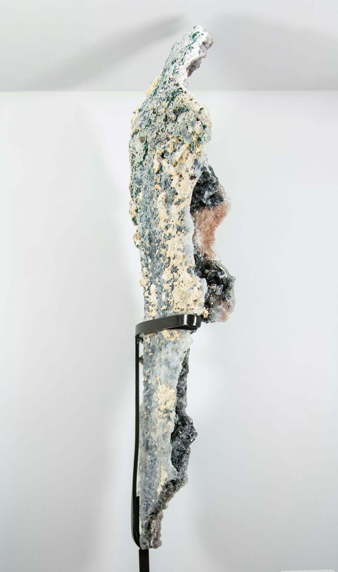 Shell amethyst presented on a lxury bronze stand contrasting the soft purple hues of the fine amethyst clusters within 22