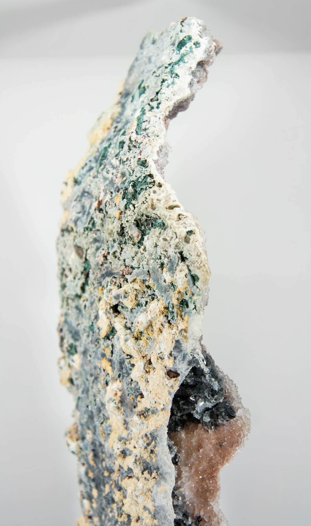 Shell amethyst presented on a lxury bronze stand contrasting the soft purple hues of the fine amethyst clusters within 28
