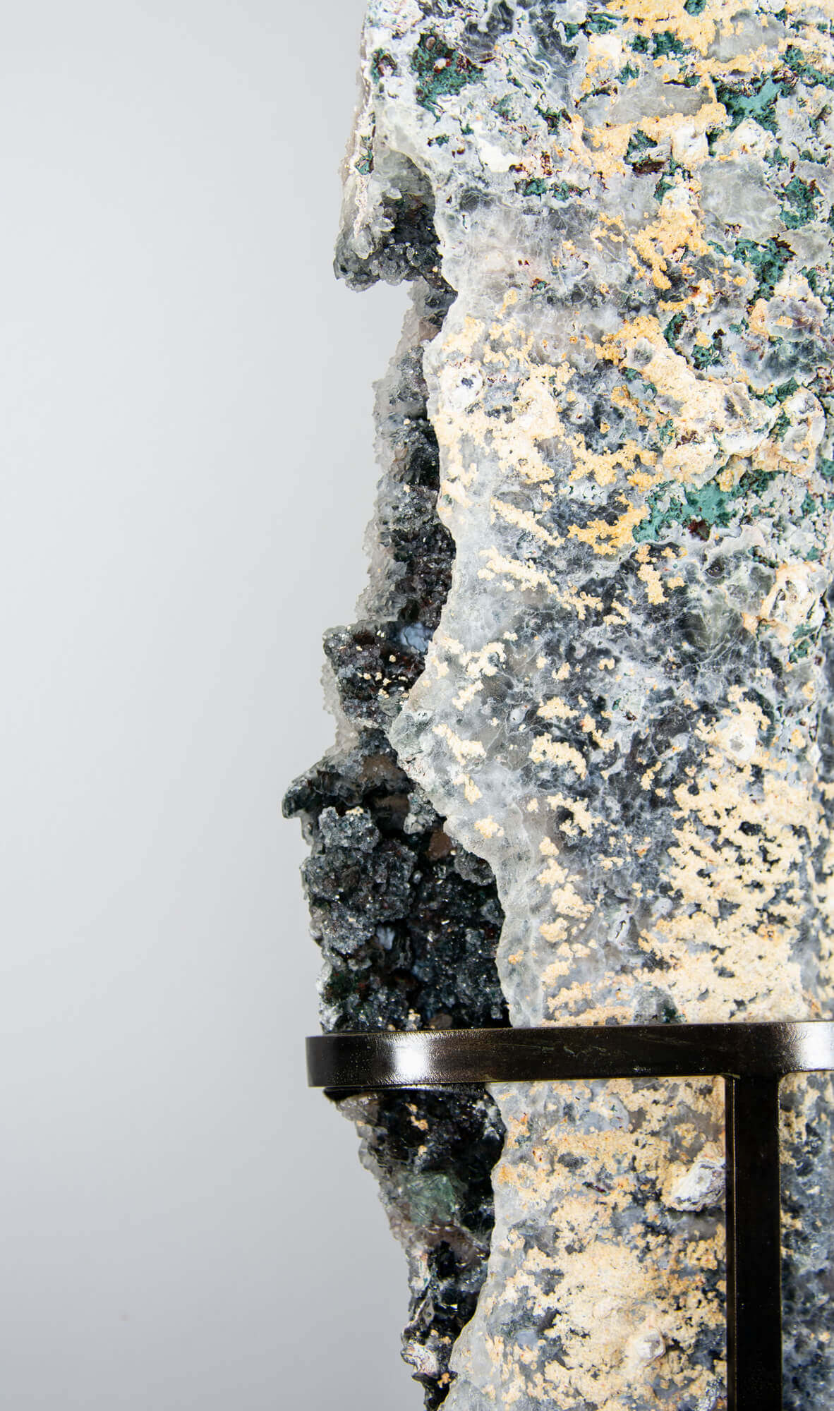 Shell amethyst presented on a lxury bronze stand contrasting the soft purple hues of the fine amethyst clusters within 29