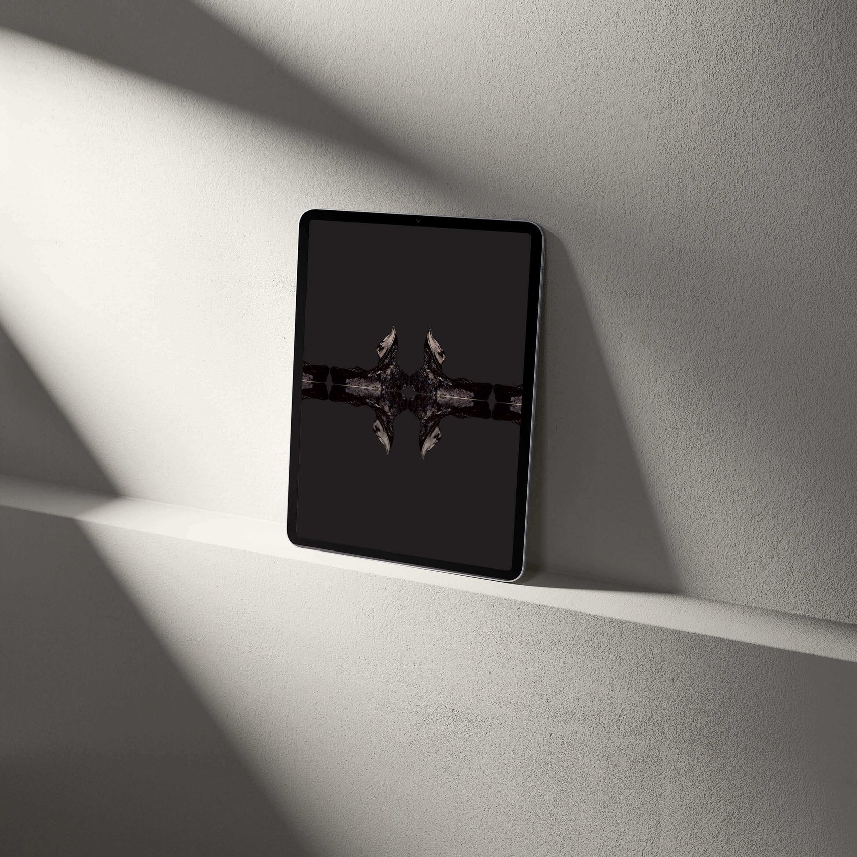 Digital Harpes Trilobite Tablet Wallpaper displayed on a sleek tablet against a minimalist background.