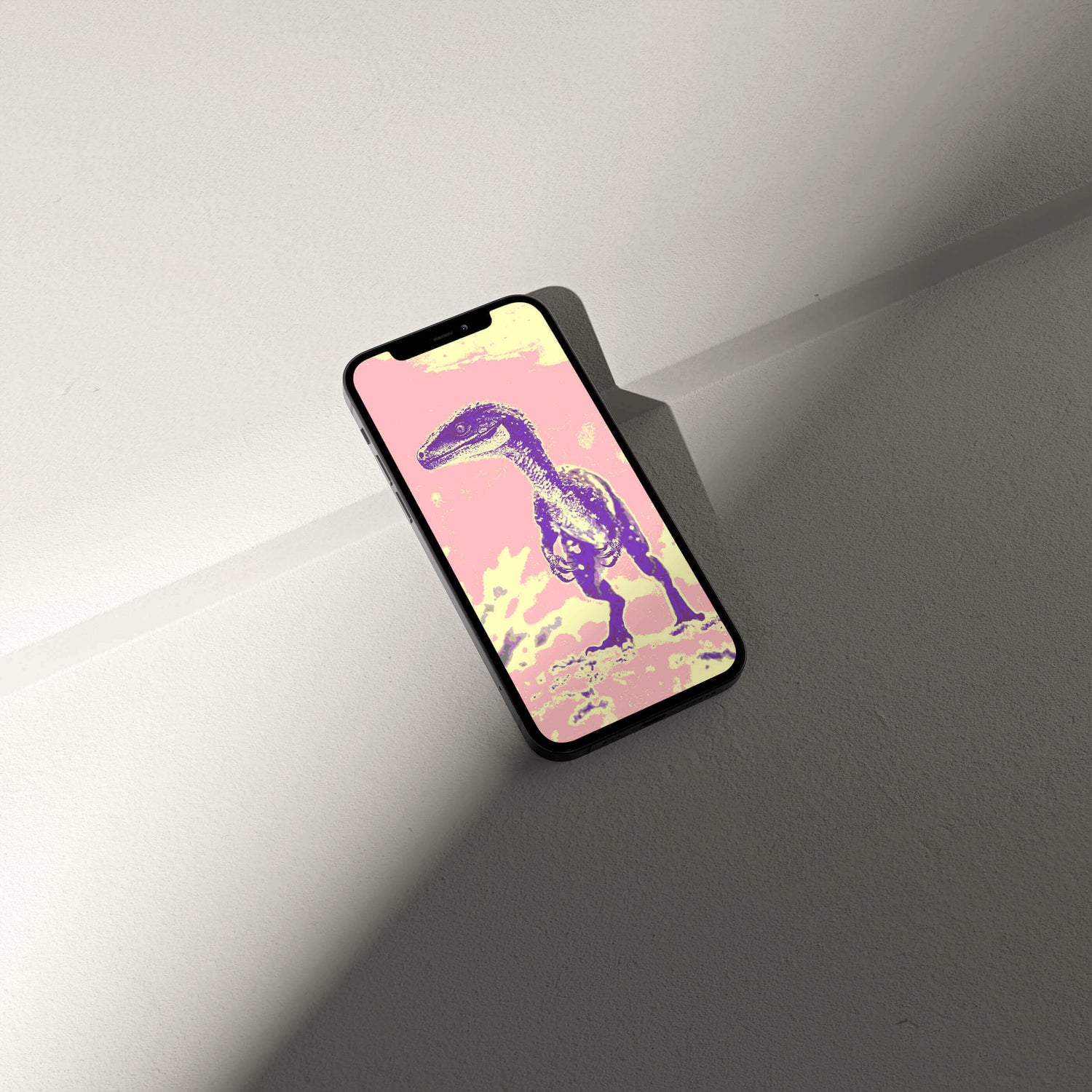 Smartphone displaying vibrant Digital Raptor wallpaper, showcasing palaeontological artistry and design elegance.