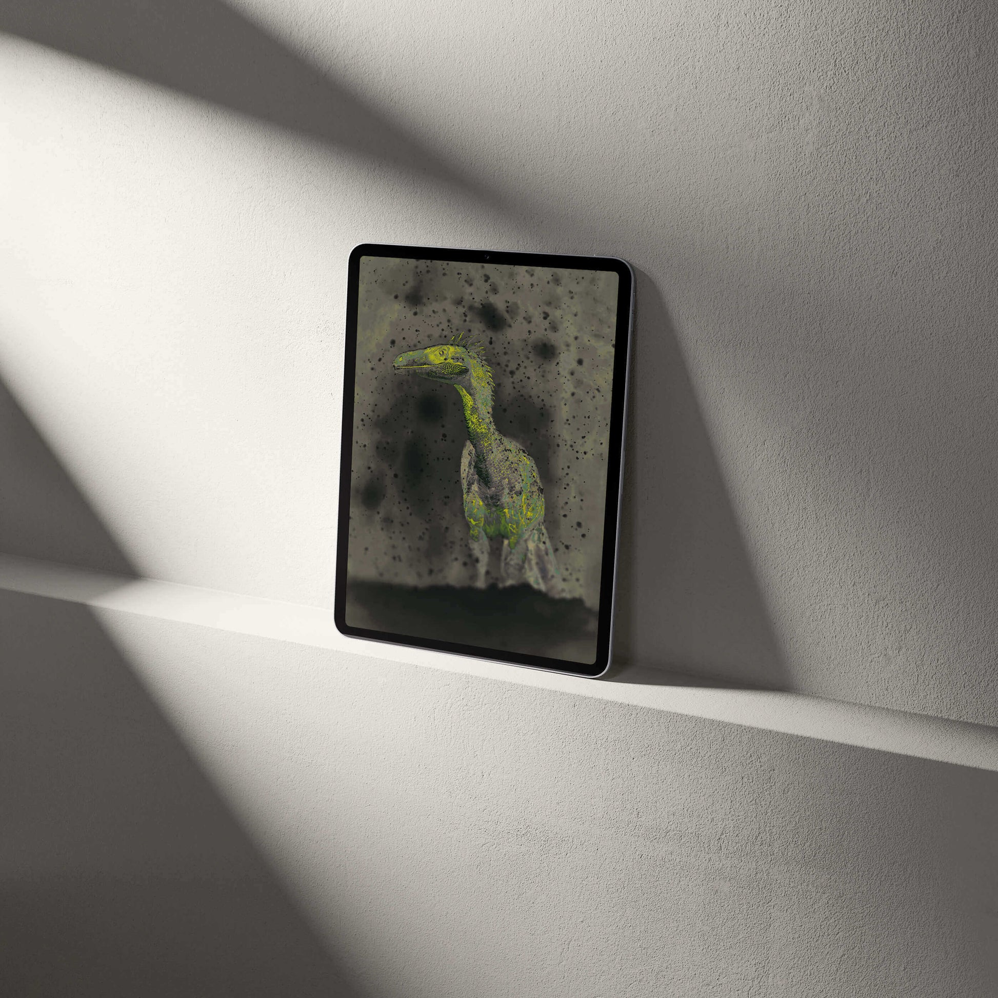 Stylish tablet displaying a VOSSO® digital Raptor wallpaper, blending palaeontological art and modern design.