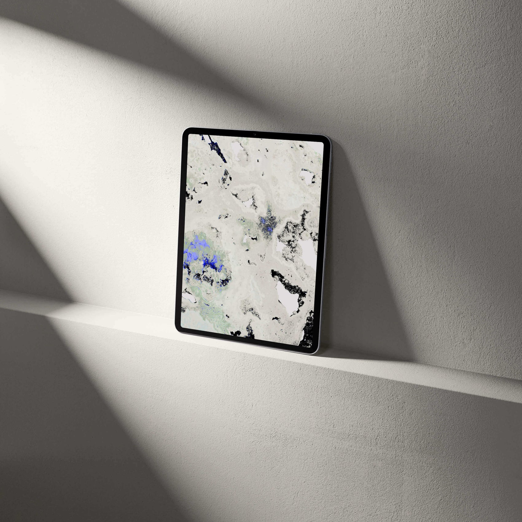 Digital Amethyst Crystal Tablet Wallpaper displayed on a shelf, showcasing mineralogical textures and vibrant colors.