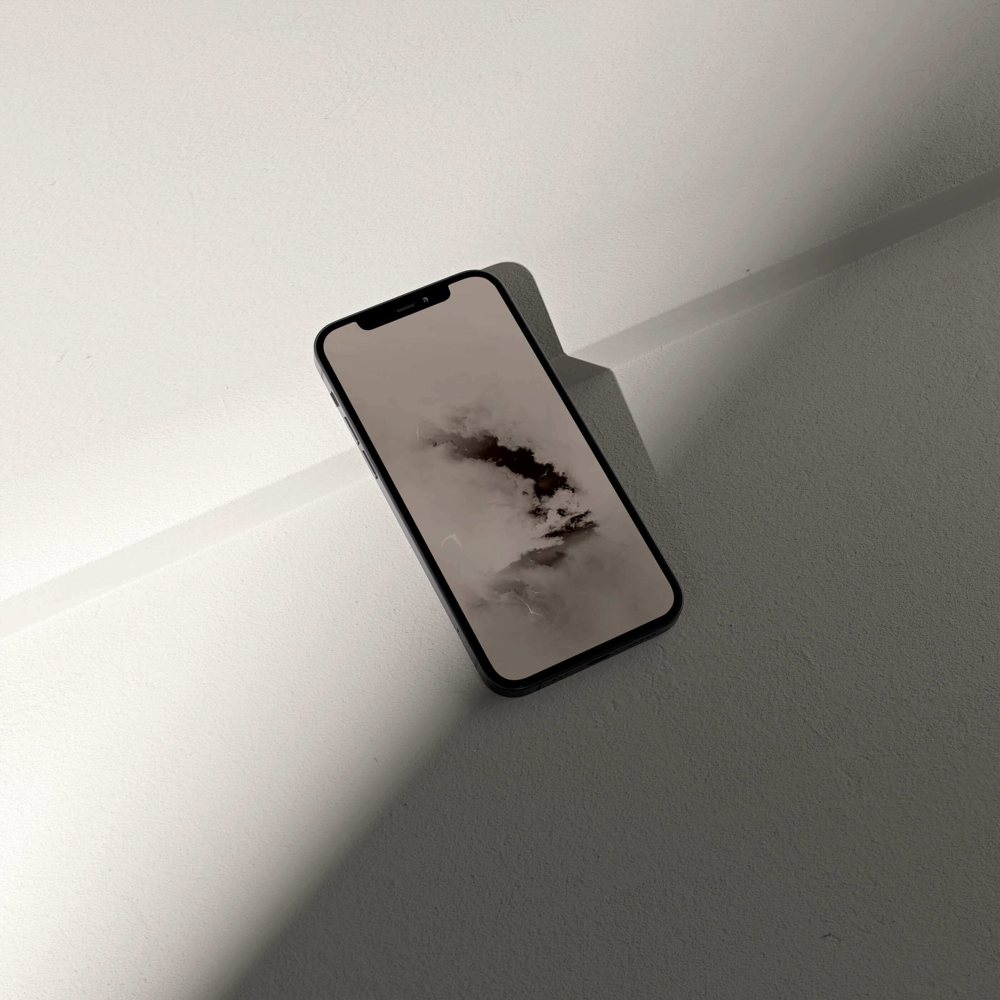 Stylish phone displaying a minimalist digital pterosaur storm wallpaper designed by VOSSO®.