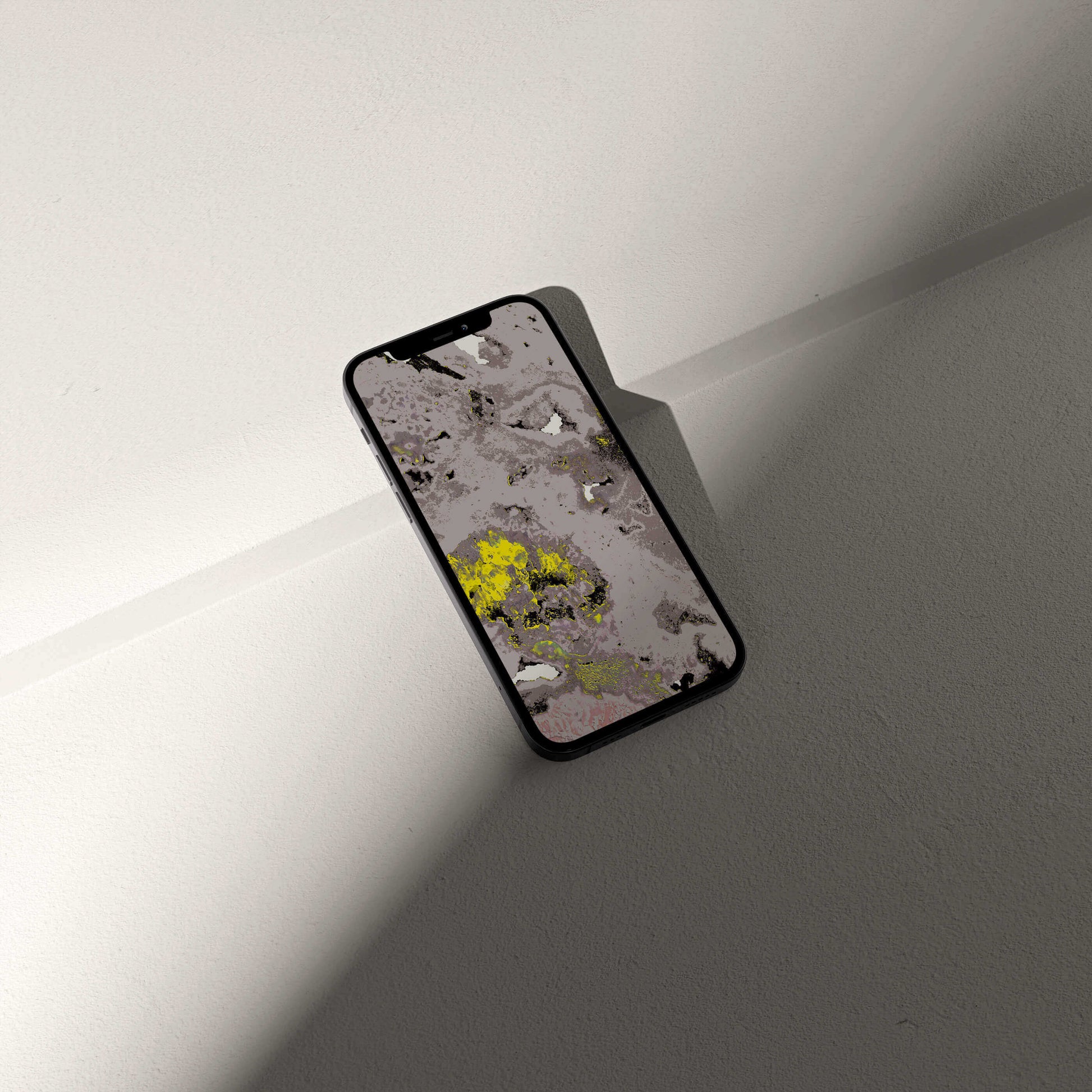 Stylish phone displaying VOSSO® digital amethyst crystal wallpaper on a minimalist surface.