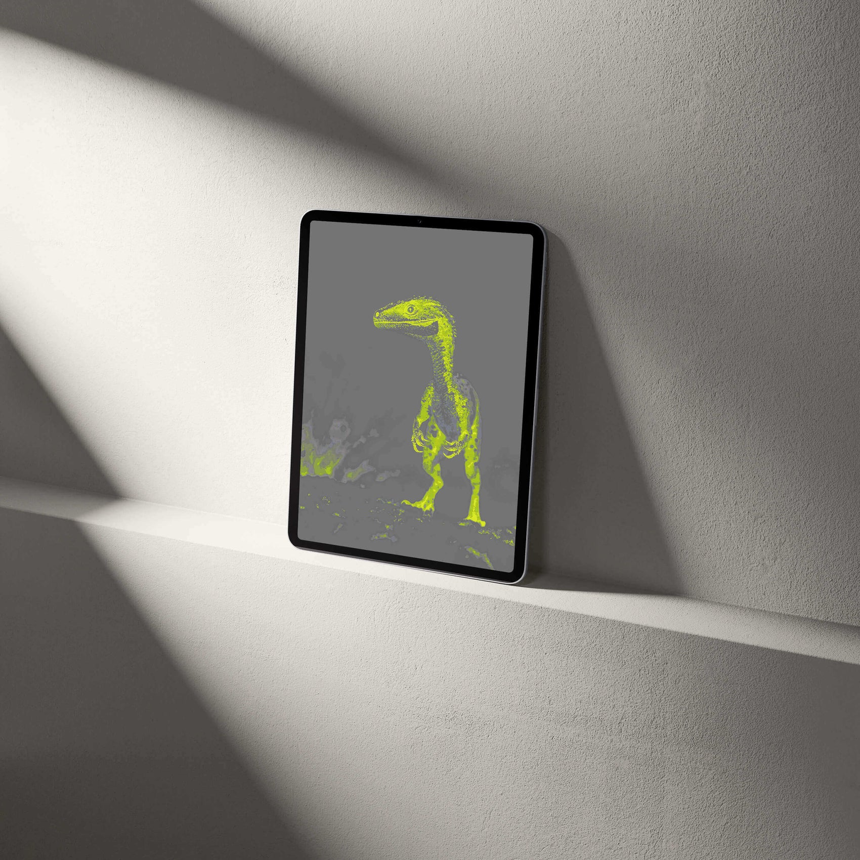 Digital raptor wallpaper on a tablet, showcasing stunning palaeontological art in vibrant green tones.