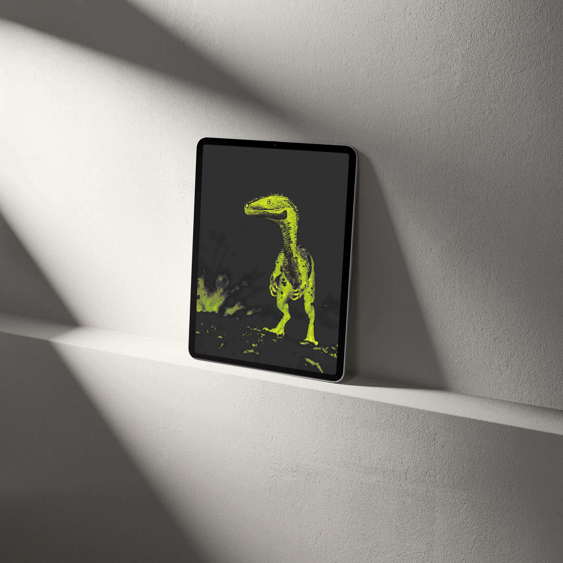 Stylish digital raptor wallpaper displayed on a tablet, showcasing vibrant palaeontological artistry.