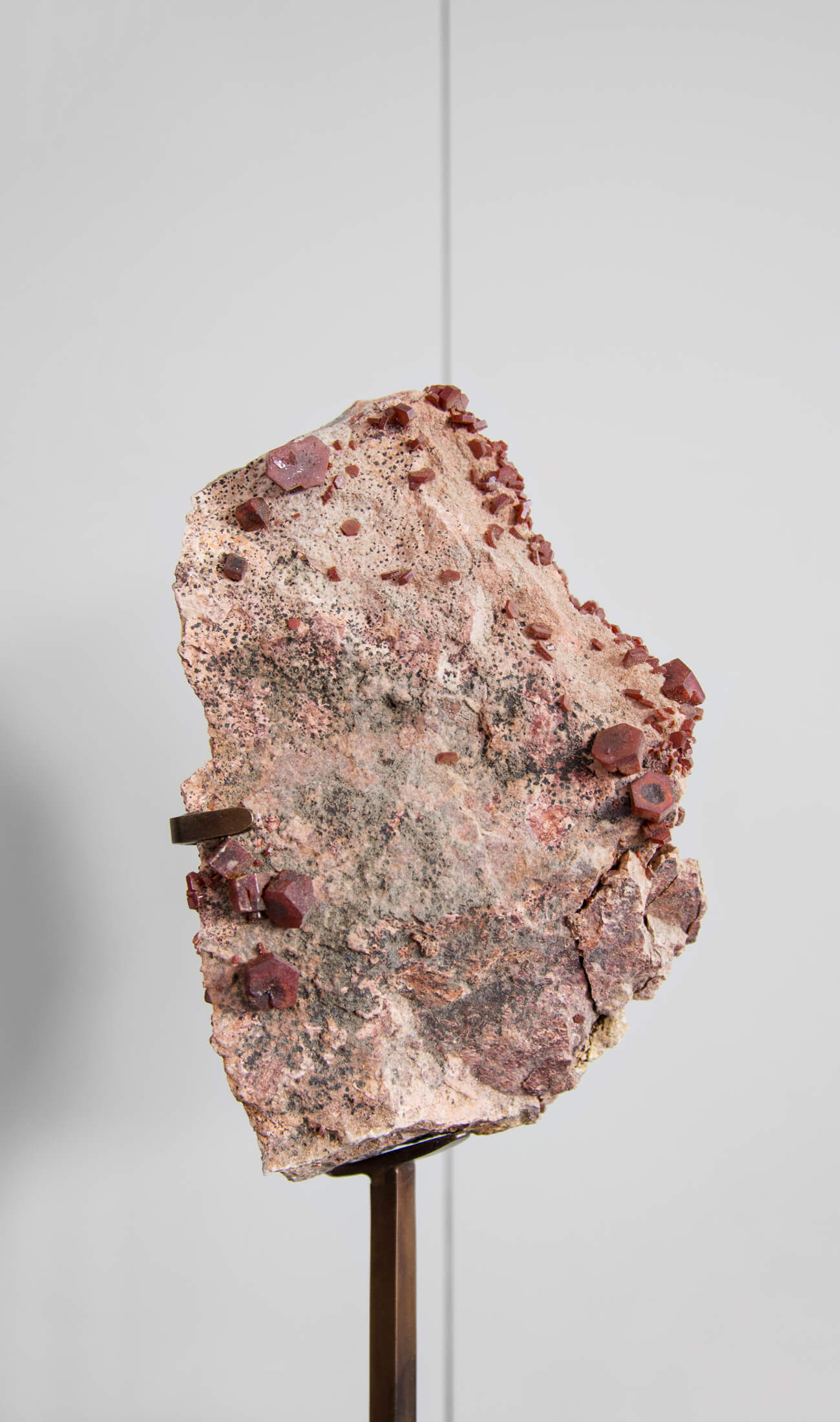 Beautiful red Vanadanite mineral gems in pink stone on a custom designed bronze Stand measuring 240mm