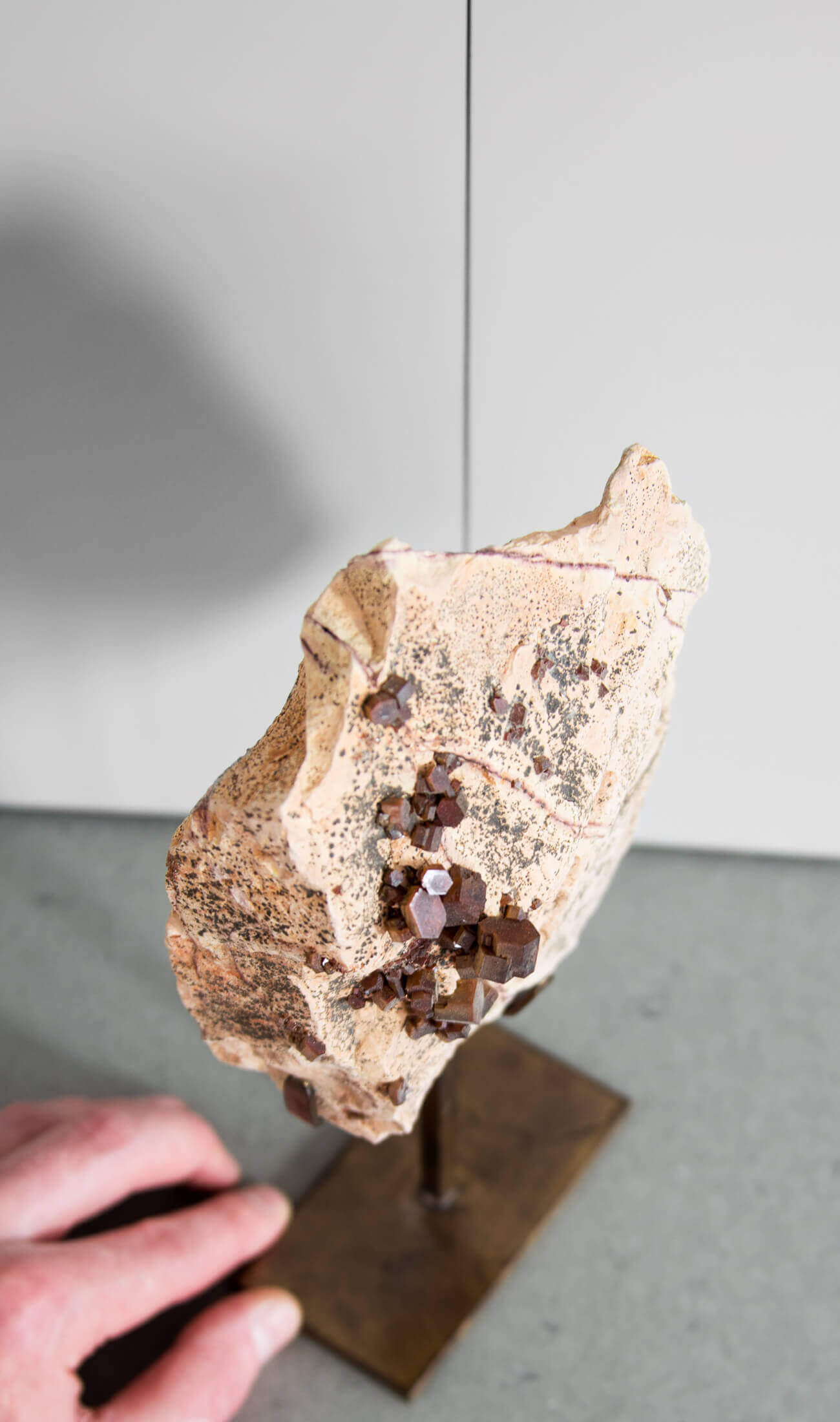 Beautiful red Vanadanite mineral gems in pink stone on a custom designed bronze Stand measuring 254mm