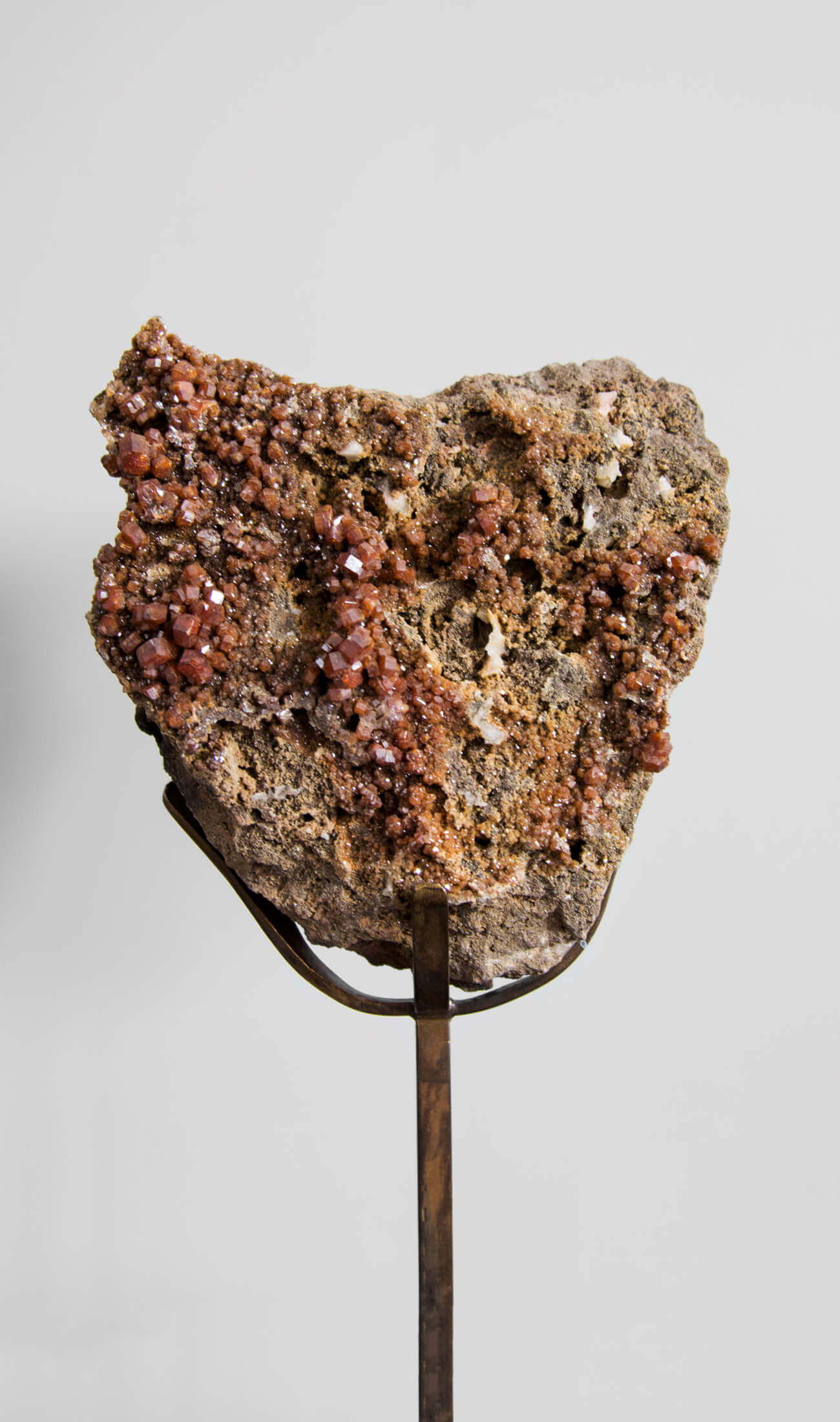 Beautiful red Vanadanite mineral gems in pink stone on a custom designed bronze Stand measuring 230mm