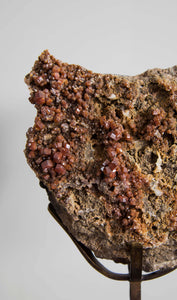 Beautiful red Vanadanite mineral gems in pink stone on a custom designed bronze Stand measuring 230mm